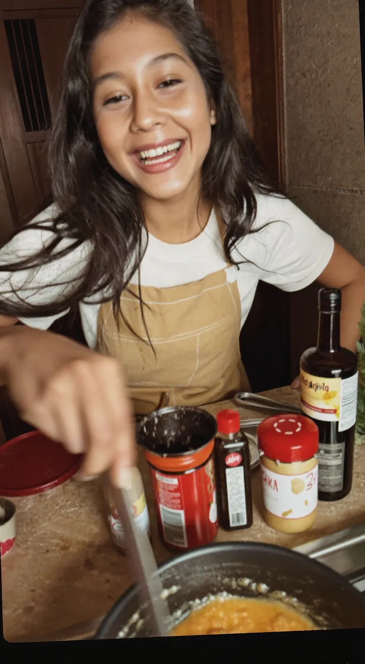 Creator filming herself cooking at home