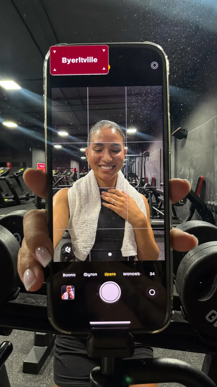 Fitness creator filming content at the gym